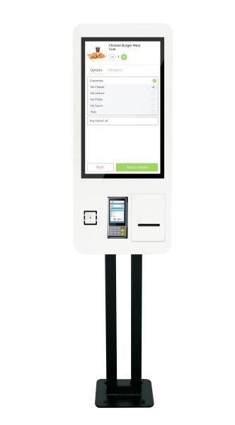 A white kiosk with a screen and a phone on it.