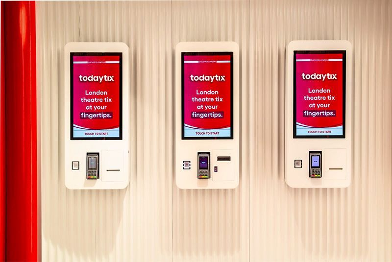 A row of kiosks that say today uk on them