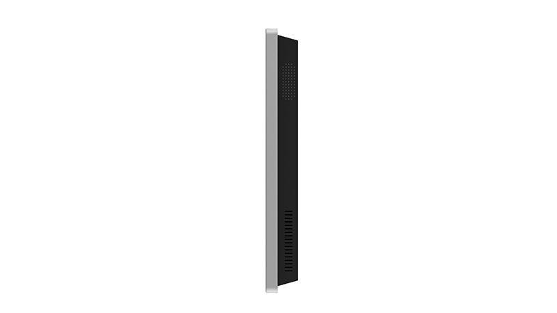 A black and silver tablet is sitting on a white surface.