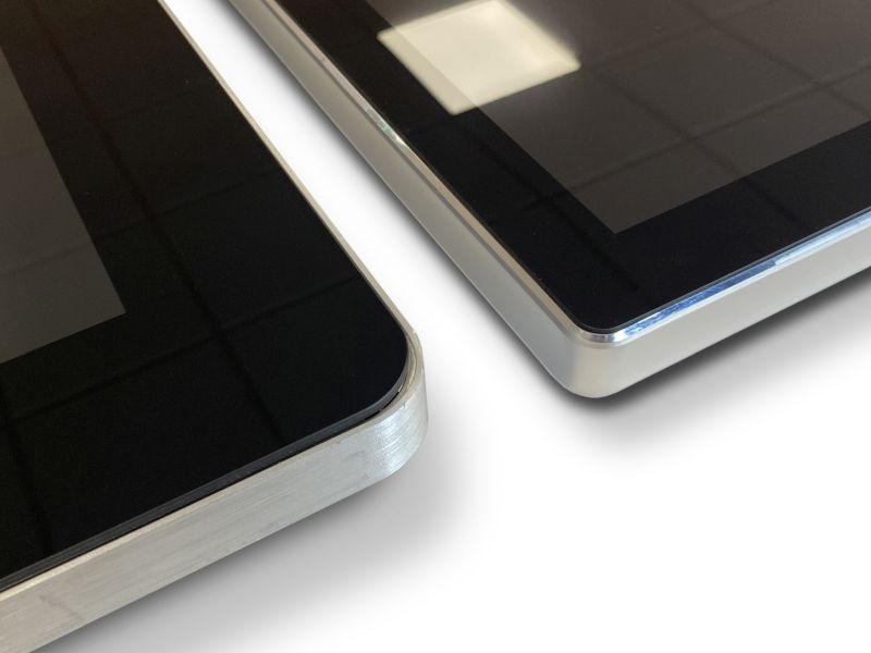 A close up of two tablets on a white surface