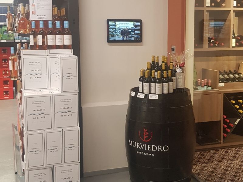 A display of murviedro wine bottles in a store