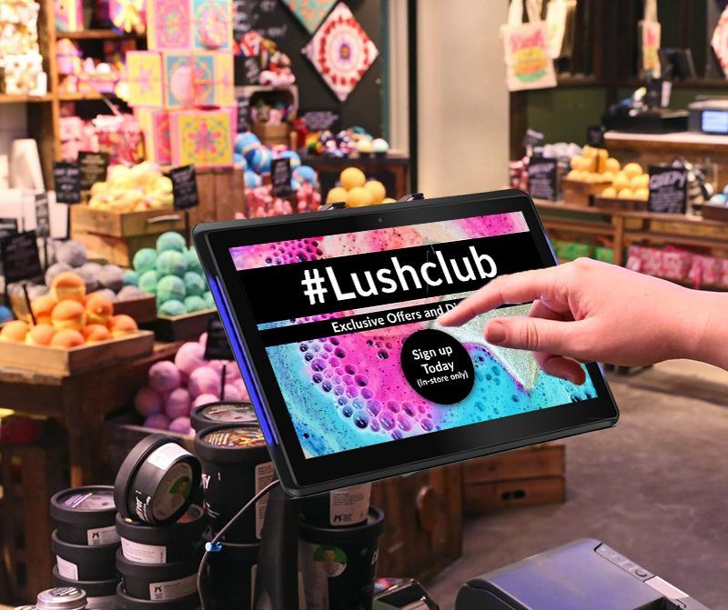 A person is using a tablet in a store.