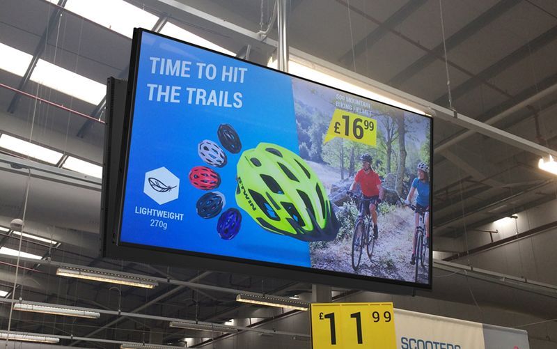 A sign in a store that says time to hit the trails