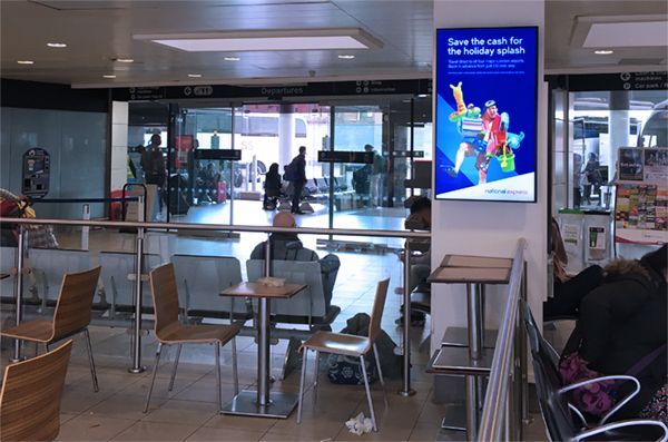 A restaurant with tables and chairs and a sign that says save the cash for the holiday season