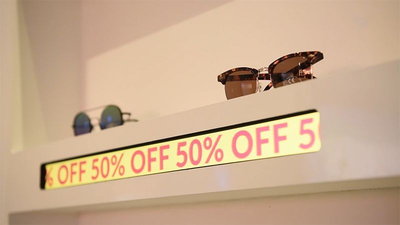 A sign on a wall that says off 50 % off 5
