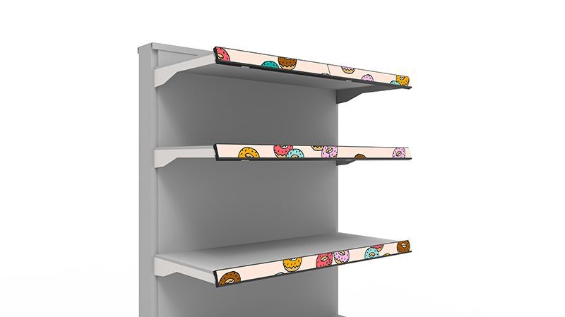 An empty store shelf with a floral design on the shelves.