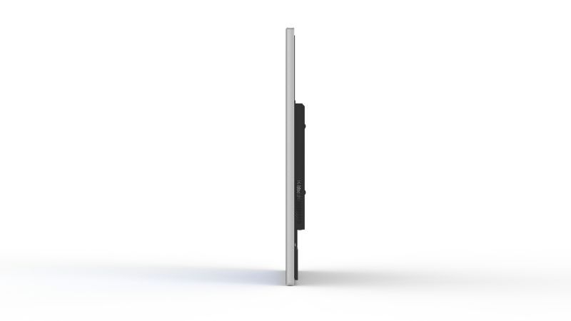 A computer monitor is sitting on a white surface.