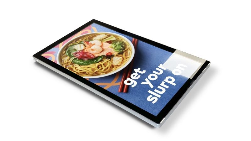 A tablet with a picture of a bowl of food and the words `` get your slurp on '' on it.