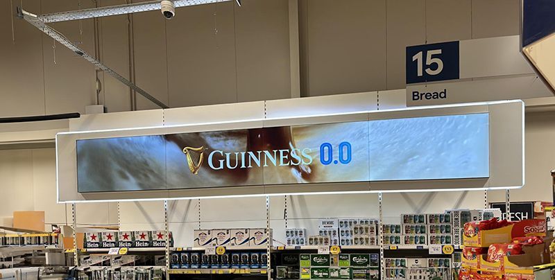 A sign in a store that says guinness 0.0