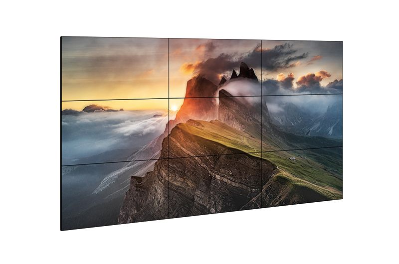 A large flat screen tv with a picture of a mountain on it.