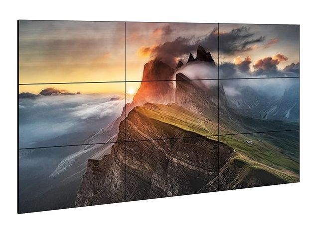 A large flat screen tv with a picture of a mountain on it.