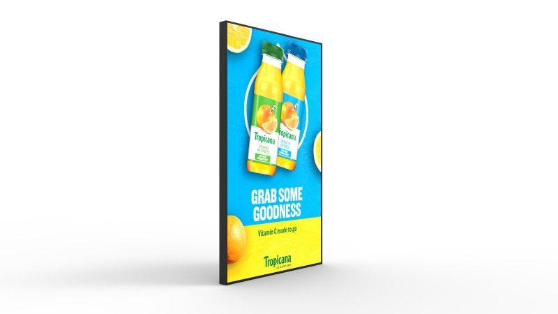 A digital sign with two bottles of orange juice on it.