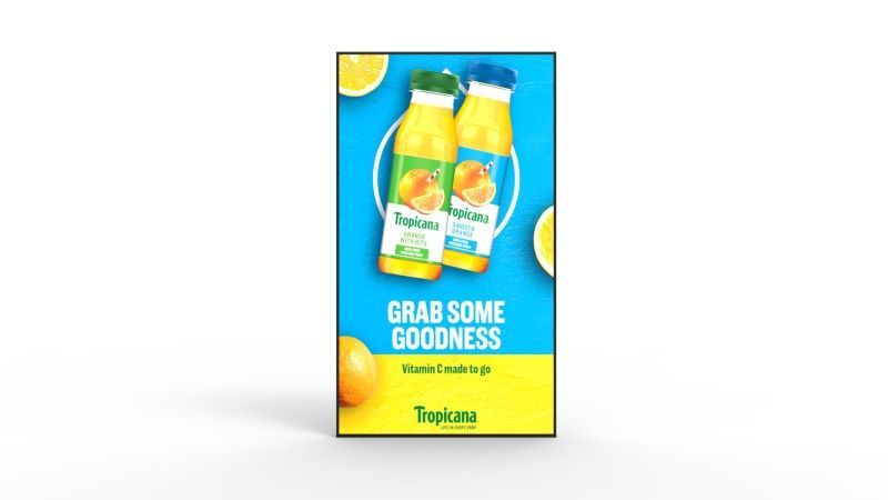 A poster with two bottles of orange juice on it.