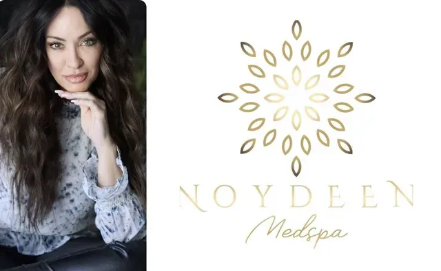 A woman posing with her hand to her chin next to the gold logo and text 