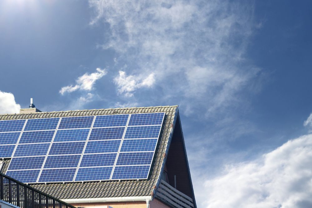 A House With A Lot Of Solar Panels On The Roof — Rapidcool Air Conditioning & Electrical In Kiama, NSW
