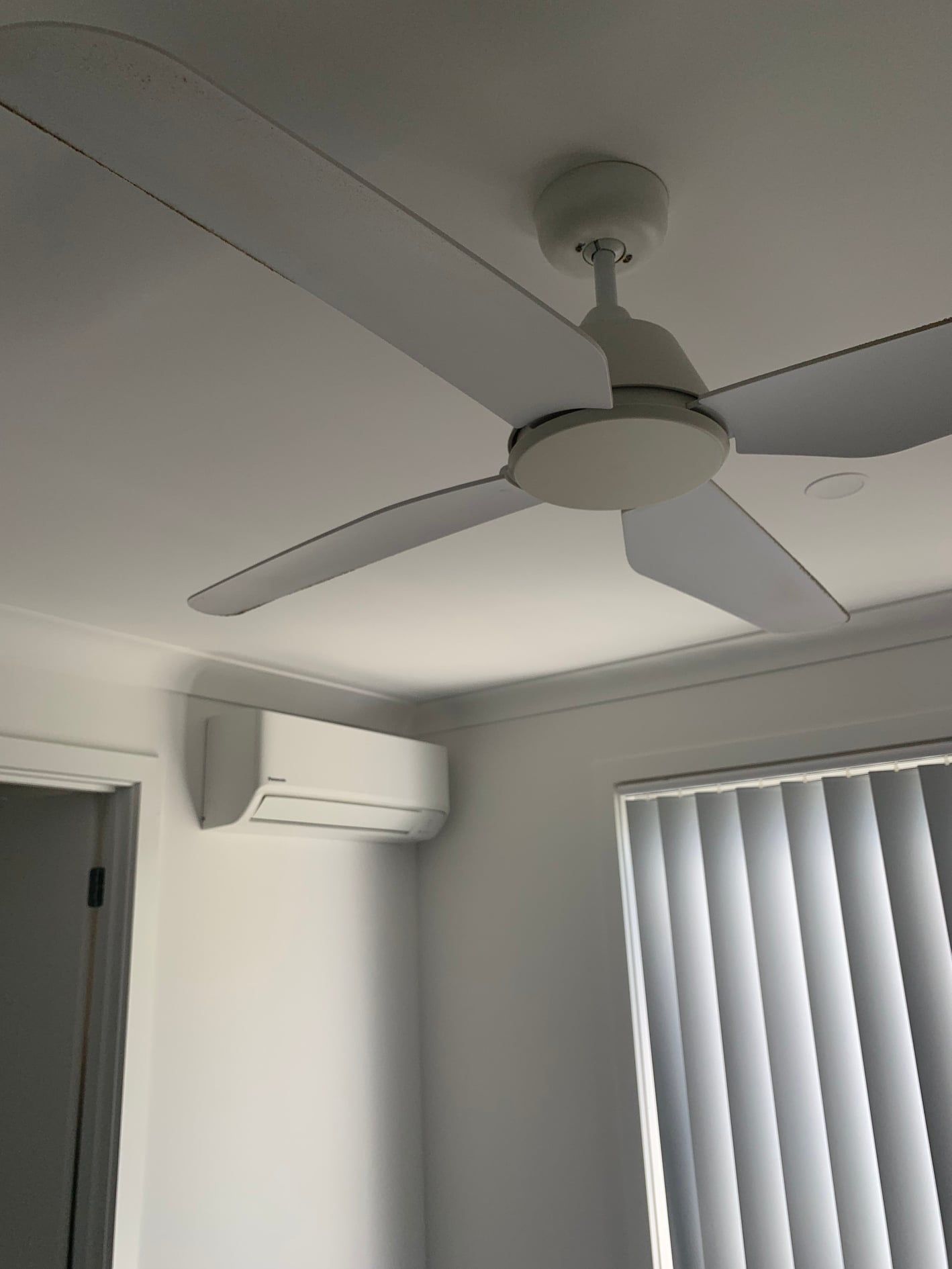 A Room With A Ceiling Fan And A Window — Rapidcool Air Conditioning & Electrical In Dapto, NSW