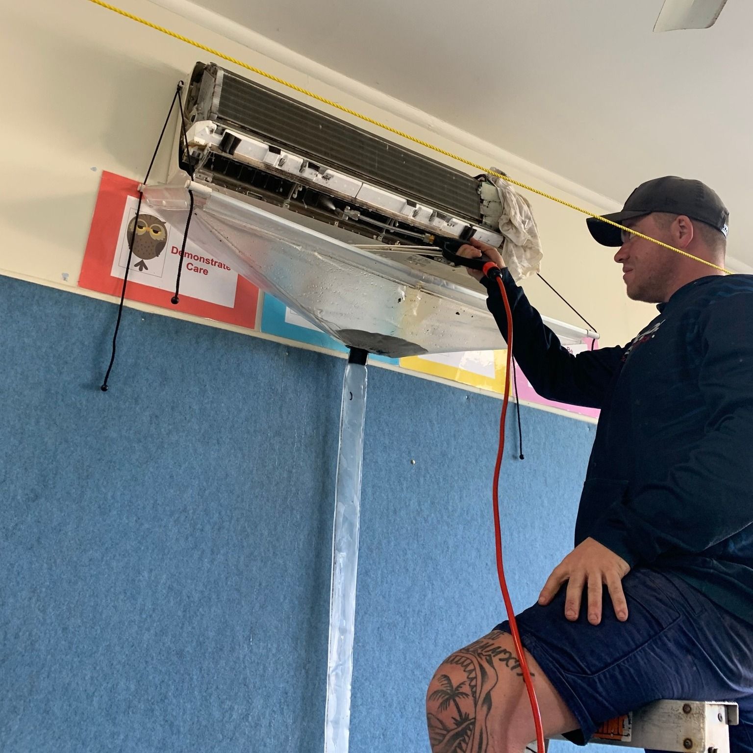 Air conditioner being repaired