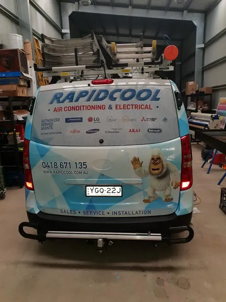 A Rapidcool Van Is Parked In A Garage — Rapidcool Air Conditioning & Electrical In Dapto, NSW