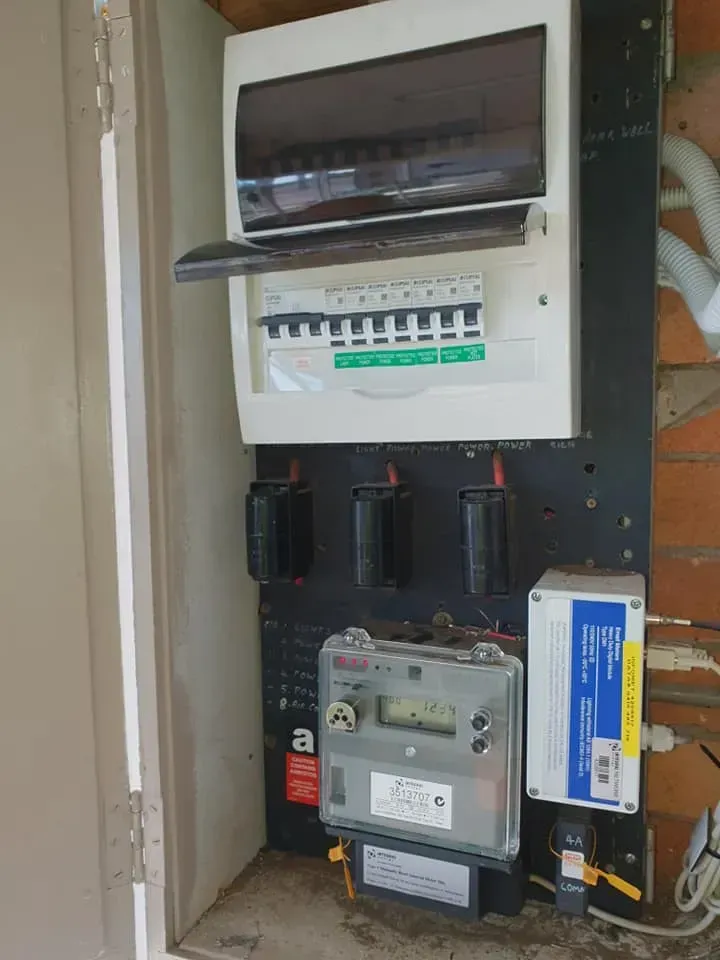 A Dirty Electrical Box With A Meter And A Breaker — Rapidcool Air Conditioning & Electrical In Dapto, NSW