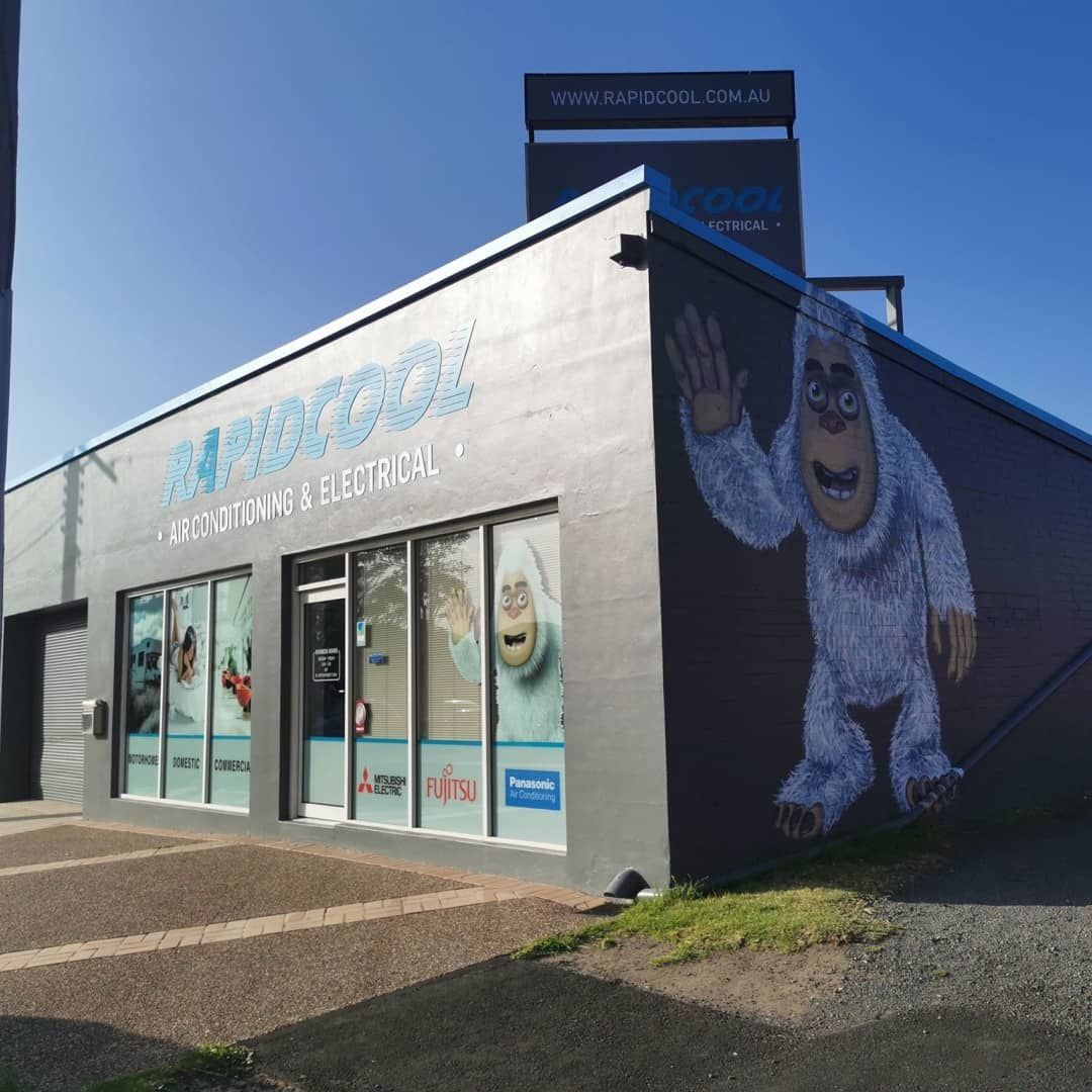 A Building With a Sign and Large Mural — Rapidcool Air Conditioning & Electrical In Wollongong, NSW