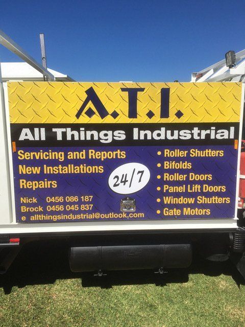 Sign on a Truck Offering Industrial Door Services — All Things Industrial in Mackay, QLD