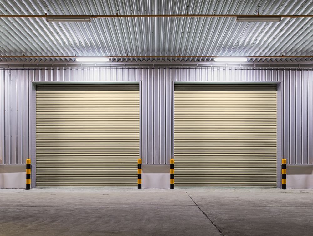 Two Closed Beige Roll-up Doors in a Warehouse — All Things Industrial in Mackay, QLD