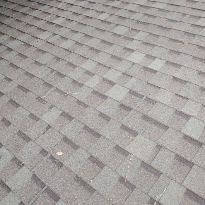 Gray asphalt shingle roof.