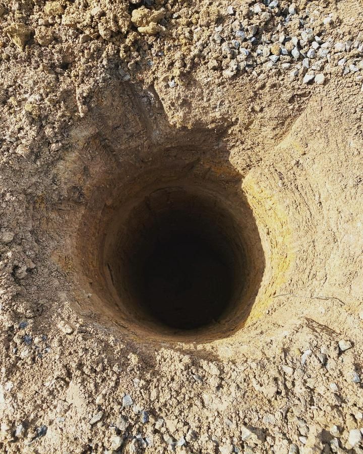 Hole in the Ground With a Hole in the Middle of It — Donaldson Plumbing & Excavations in Kiewa, VIC