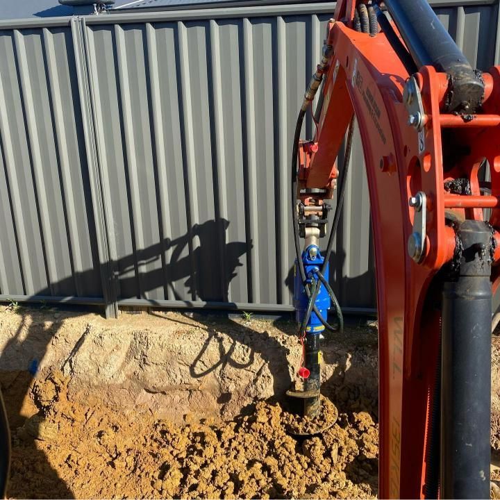Machine is Digging a Hole in the Ground — Donaldson Plumbing & Excavations in Albury, VIC