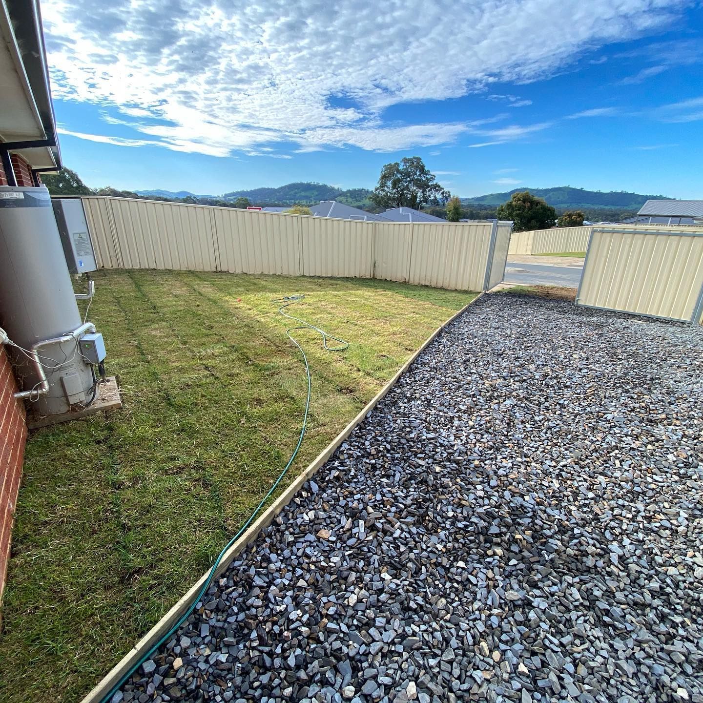 Gravel Driveway Leading to a Fenced in Yard — Donaldson Plumbing & Excavations in Kiewa, VIC