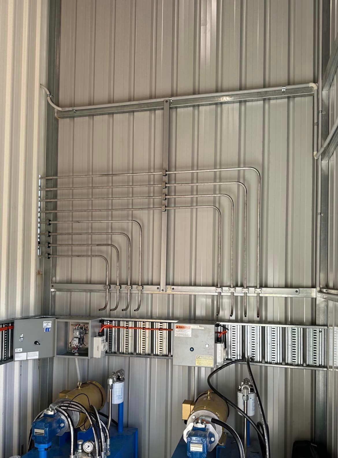 Room With a Lot of Pipes Hanging on the Wall — Donaldson Plumbing & Excavations in Baranduda, VIC