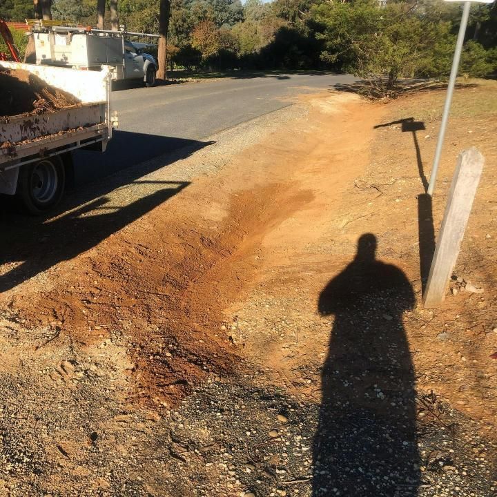 Truck is Parked on the Side of the Road Next to a Pile of Dirt — Donaldson Plumbing & Excavations in Chiltern, VIC