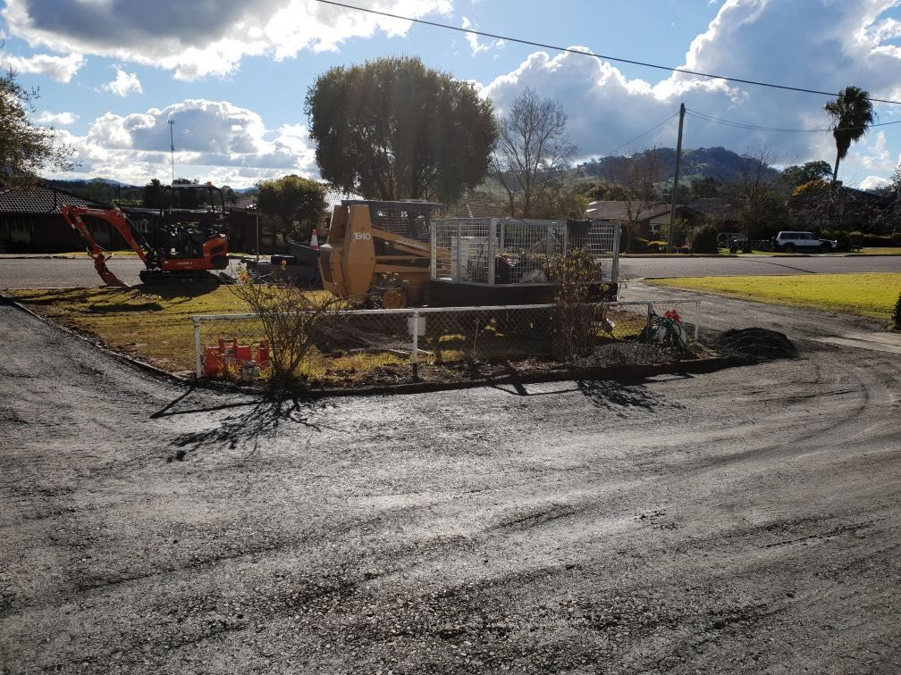 Construction Vehicle is Parked on the Side of the Road — Donaldson Plumbing & Excavations in Chiltern, VIC