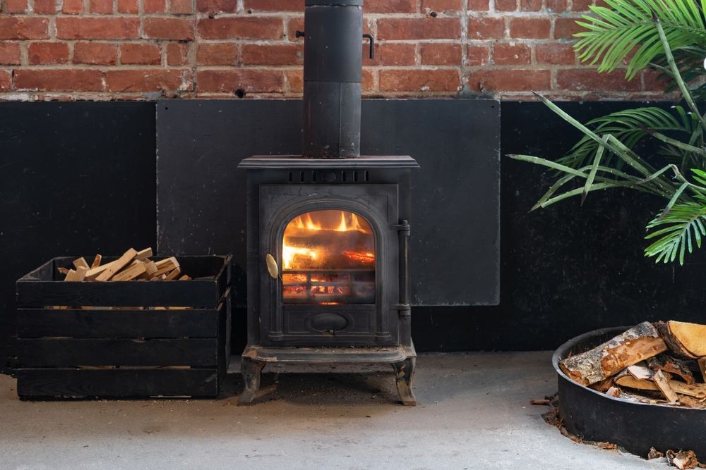 Fireplace With Burning Flames — Donaldson Plumbing & Excavations in Baranduda, VIC