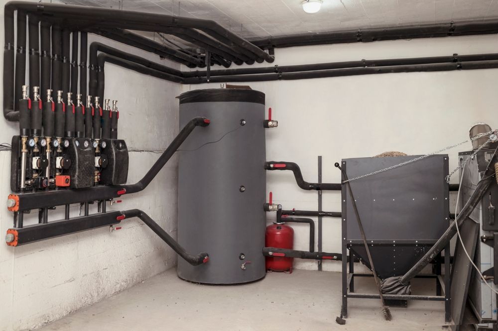 Heating System With Pipes, Water Tank, and Boiler — Donaldson Plumbing & Excavations in Wodonga, VIC