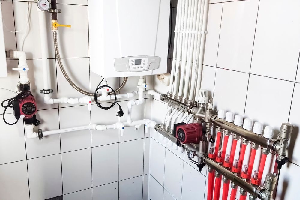 White-Tiled Utility Room With a Gas Boiler — Donaldson Plumbing & Excavations in Wodonga, VIC