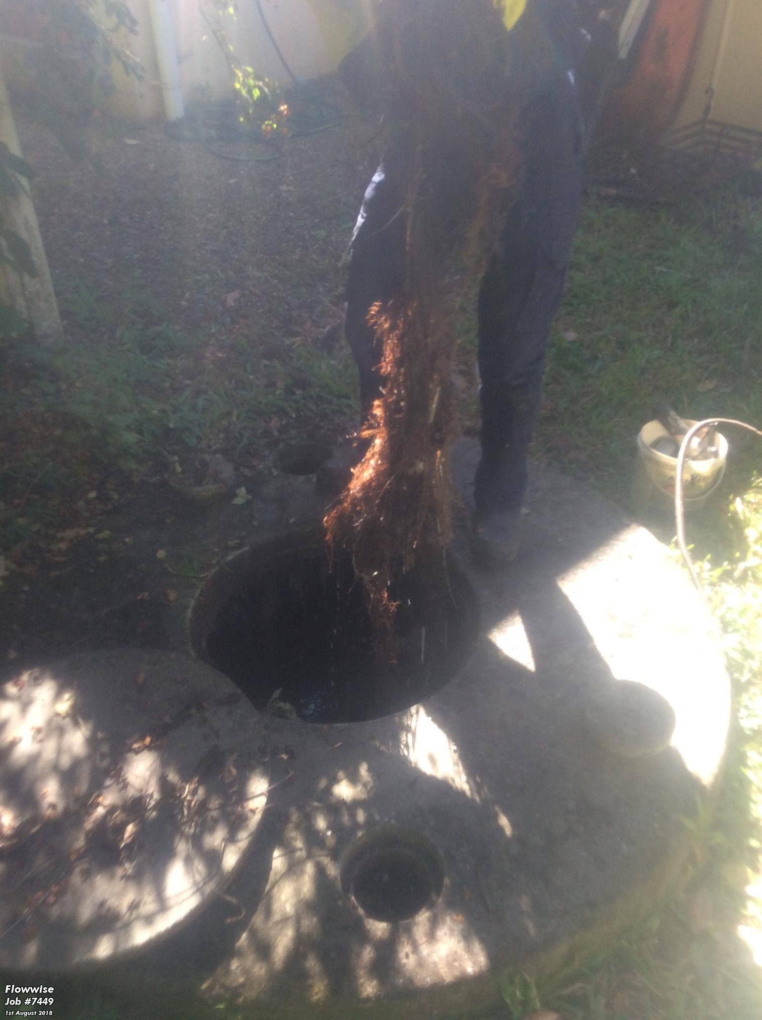 A Person is Standing Next to a Hole in the Ground — FlowWise in Maroochydore, QLD