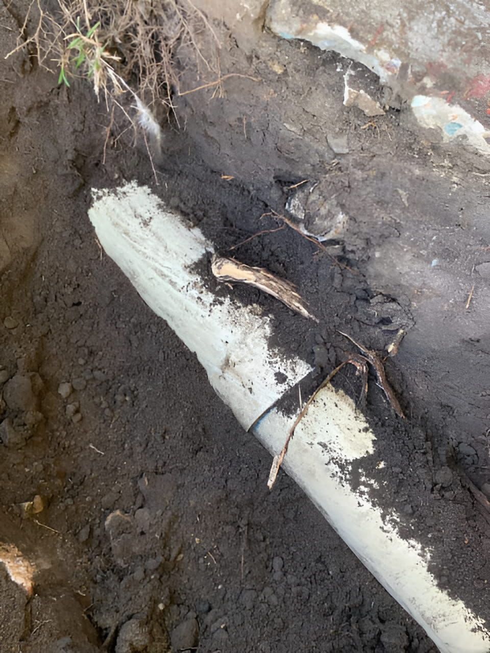 A White Pipe is Laying in the Dirt — FlowWise in Maroochydore, QLD