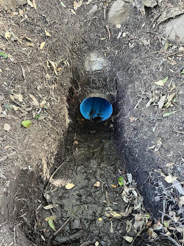 A Blue Pipe is Coming Out of a Hole in the Ground — FlowWise in Maroochydore, QLD