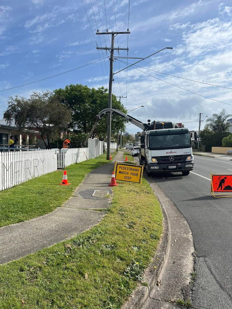 A Truck is Parked on the Side of the Road Next to a Sidewalk — FlowWise in Maroochydore, QLD