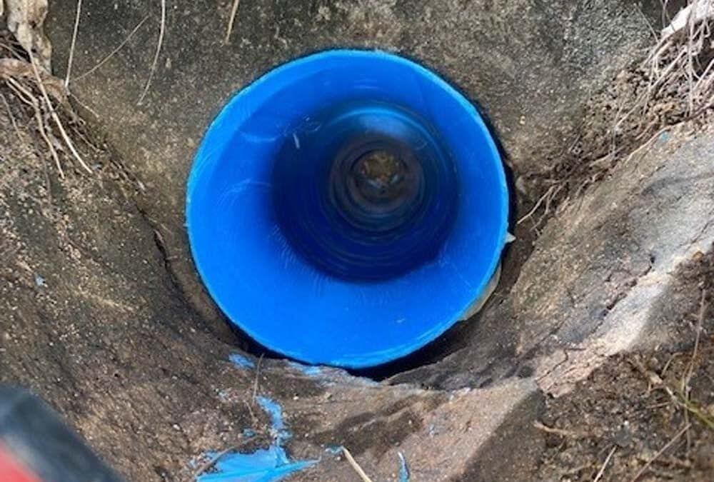 A Blue Pipe is Sitting in the Middle of a Hole in the Ground — FlowWise in Maroochydore, QLD
