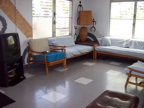 A living room filled with furniture and a television.