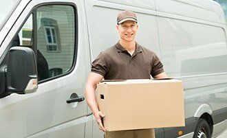 Delivery man holding box - Warehousing Company in Myrtle Beach, SC