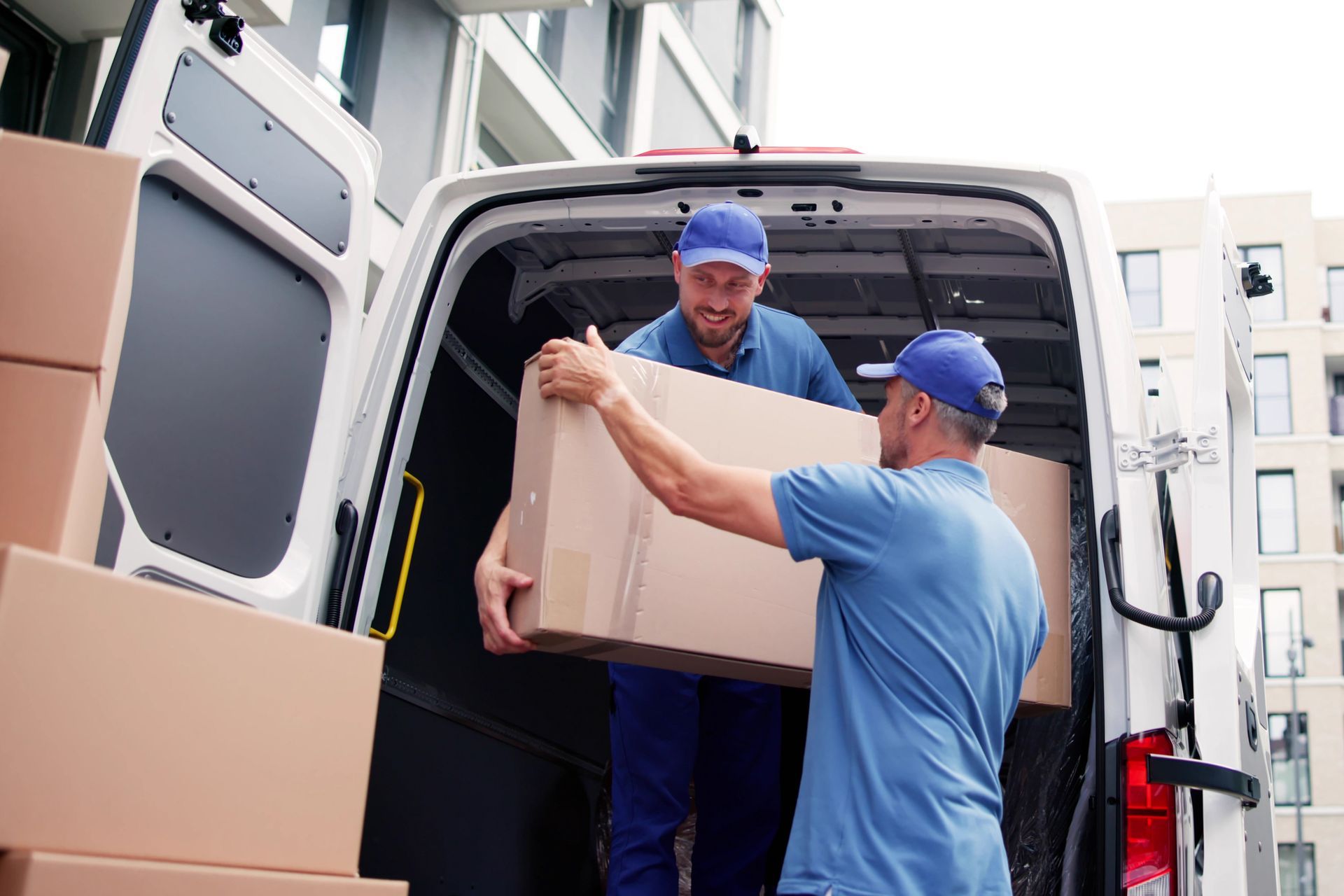 Men carrying a box into a van | Residential Moving Services in Myrtle Beach SC