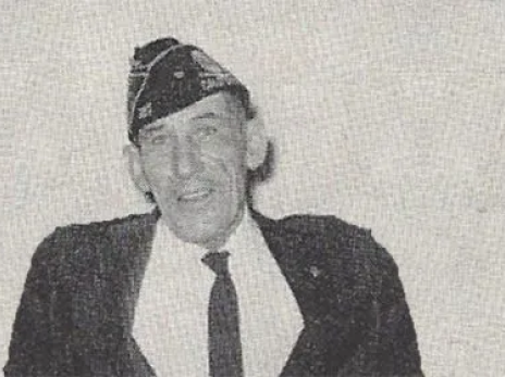 A man in a suit and tie is wearing a hat. | Liebsack Auto Services
