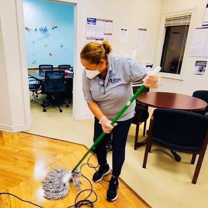 Janitor Cleaning White Desk in Office — Elizabeth, NJ — Omega Maintenance Corp