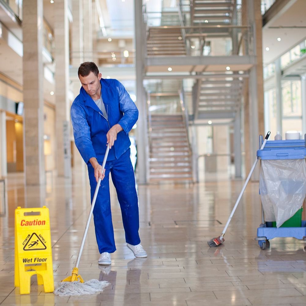 Male Cleaner Mopping in Office — Elizabeth, NJ — Omega Maintenance Corp