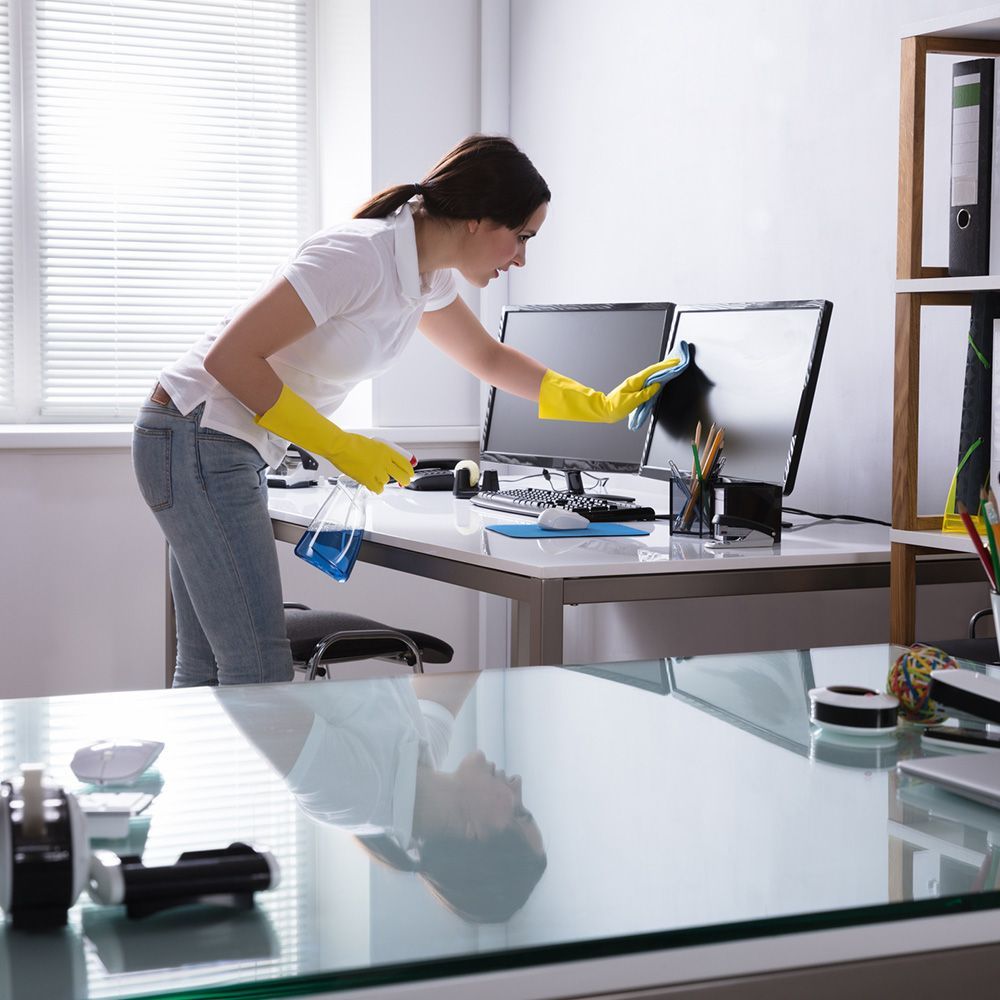 Woman Cleaning Computer in Office — Elizabeth, NJ — Omega Maintenance Corp