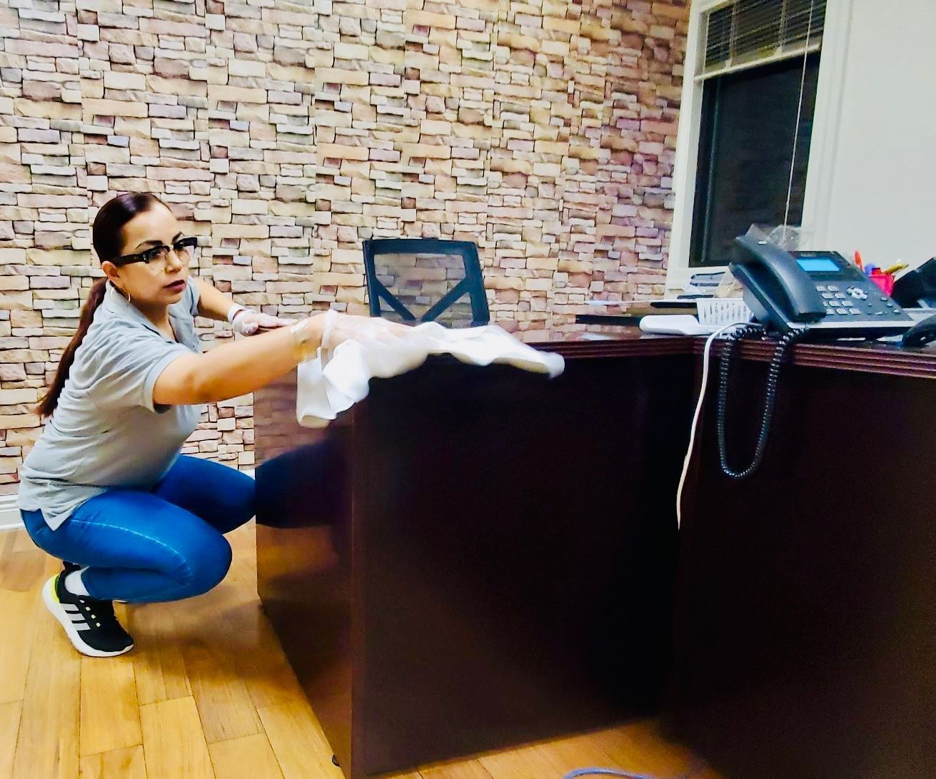 Janitor Wiping the Office Furniture — Elizabeth, NJ — Omega Maintenance Corp