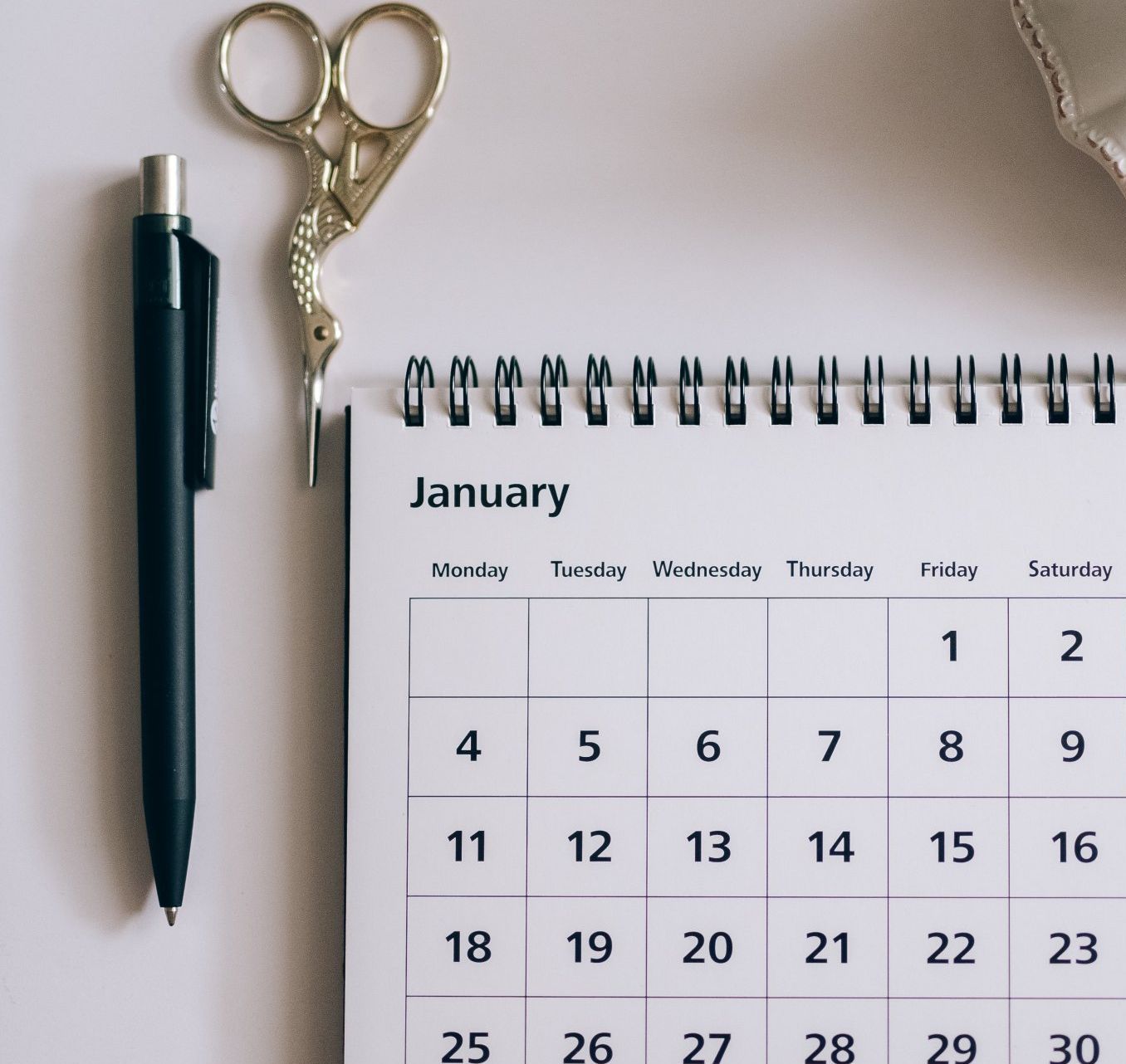 A calendar for january sits on a table